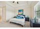Comfortable bedroom boasts tray ceiling and ample natural light, creating a relaxing retreat at 13215 Ramblewood Trl, Bradenton, FL 34211