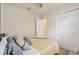 Bedroom features a bed, ceiling fan, natural light, neutral decor and a closet with sliding doors at 13215 Ramblewood Trl, Bradenton, FL 34211