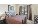 Tastefully decorated bedroom with a large window and elegant curtains, creating a serene atmosphere at 13215 Ramblewood Trl, Bradenton, FL 34211