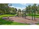 A community playground with swings, slides, and climbing structures for residents to enjoy at 13215 Ramblewood Trl, Bradenton, FL 34211