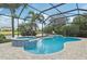 A private pool and jacuzzi surrounded by lush tropical landscaping and a screened enclosure at 13215 Ramblewood Trl, Bradenton, FL 34211