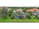 Beautiful backyard featuring a screened-in pool with lush landscaping creating a private oasis at 13215 Ramblewood Trl, Bradenton, FL 34211