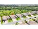 Aerial view of single Gathering homes featuring tile roofs, well-manicured lawns, and spacious driveways at 17723 Polo Trl, Bradenton, FL 34211