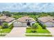 Beautiful single-story home featuring a tile roof, manicured lawn, and a two-car garage, all set on a verdant lot at 17723 Polo Trl, Bradenton, FL 34211