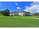 Condo building showcasing its location on the golf course at 6505 Stone River Rd # 104, Bradenton, FL 34203