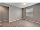 Cozy bedroom with neutral walls and a window at 1174 S Mcduff St, North Port, FL 34288