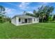 Newly built home with a large backyard and covered patio at 1174 S Mcduff St, North Port, FL 34288