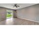 Bright living room with gray walls and vinyl plank flooring at 1174 S Mcduff St, North Port, FL 34288