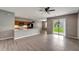 Open concept kitchen with granite countertops and wood cabinets at 1174 S Mcduff St, North Port, FL 34288