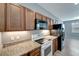 Modern kitchen with granite countertops and stainless steel appliances at 1174 S Mcduff St, North Port, FL 34288