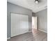 Bedroom with double doors and ceiling fan at 1174 S Mcduff St, North Port, FL 34288