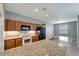 Modern kitchen with granite countertops and stainless steel appliances at 1174 S Mcduff St, North Port, FL 34288