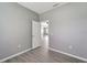 Bedroom with door to another room and gray walls at 1174 S Mcduff St, North Port, FL 34288