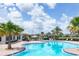 Relaxing kidney-shaped pool with plenty of lounge chairs at 17723 Polo Trl, Bradenton, FL 34211