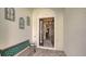 Inviting entryway with tiled floor and bench at 7275 Lismore Ct, Lakewood Ranch, FL 34202