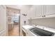Laundry room with washer, dryer and access to kitchen at 7275 Lismore Ct, Lakewood Ranch, FL 34202