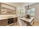 Elegant dining area with marble table and sideboard at 7275 Lismore Ct, Lakewood Ranch, FL 34202