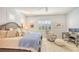 Spacious main bedroom with king-size bed and home office at 7275 Lismore Ct, Lakewood Ranch, FL 34202