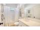 Clean bathroom with white vanity, bathtub and shower at 7275 Lismore Ct, Lakewood Ranch, FL 34202