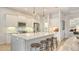 Modern kitchen with white cabinets, stainless steel appliances and large island at 7275 Lismore Ct, Lakewood Ranch, FL 34202