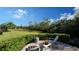 Peaceful patio with seating area and view of backyard at 7275 Lismore Ct, Lakewood Ranch, FL 34202