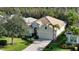 Single-story home with tile roof and lush landscaping at 7275 Lismore Ct, Lakewood Ranch, FL 34202