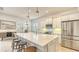 Modern kitchen with white cabinets, stainless steel appliances, and large island at 7275 Lismore Ct, Lakewood Ranch, FL 34202