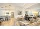 Open concept kitchen with white cabinets, stainless steel appliances, and an island at 7275 Lismore Ct, Lakewood Ranch, FL 34202
