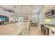 Modern kitchen featuring a large island and breakfast area at 7275 Lismore Ct, Lakewood Ranch, FL 34202