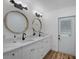 Double vanity bathroom with a modern design and plenty of light at 353 Suwanee Ave, Sarasota, FL 34243