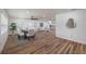 Open concept dining room flows into living room, hardwood floors at 353 Suwanee Ave, Sarasota, FL 34243