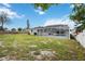 Large backyard with screened-in pool and grassy area at 353 Suwanee Ave, Sarasota, FL 34243