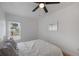 Cozy bedroom featuring a queen-size bed and large window at 353 Suwanee Ave, Sarasota, FL 34243