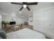 Bright bedroom with modern ceiling fan and built-in closet at 353 Suwanee Ave, Sarasota, FL 34243