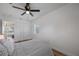 Bedroom with queen bed, window, and double doors at 353 Suwanee Ave, Sarasota, FL 34243