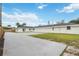 Modern home exterior with three-car garage and spacious driveway at 353 Suwanee Ave, Sarasota, FL 34243