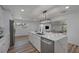 Modern kitchen with white cabinets, stainless steel appliances, and an expansive island at 353 Suwanee Ave, Sarasota, FL 34243