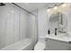 Updated bathroom with a stylish vanity and marble tile at 353 Suwanee Ave, Sarasota, FL 34243