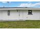 Side view of the house showcasing a white exterior at 353 Suwanee Ave, Sarasota, FL 34243