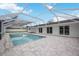 Inviting swimming pool with a screened enclosure at 353 Suwanee Ave, Sarasota, FL 34243