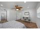 Bedroom with hardwood floors, ceiling fan, and plenty of natural light at 353 Suwanee Ave, Sarasota, FL 34243