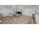 Open living space featuring light wood floors and ample natural light at 353 Suwanee Ave, Sarasota, FL 34243
