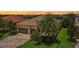 Single-Gathering home with tile roof, two-car garage, and landscaped yard at 13215 Ramblewood Trl, Bradenton, FL 34211