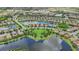 Aerial view of a lakefront community with many homes and green spaces at 13215 Ramblewood Trl, Bradenton, FL 34211