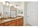 Double vanity bathroom with granite countertops at 13215 Ramblewood Trl, Bradenton, FL 34211