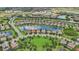 Aerial view of a large community with numerous homes and lakes at 13215 Ramblewood Trl, Bradenton, FL 34211