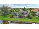 Home with a private pool and screened enclosure overlooking a canal at 13215 Ramblewood Trl, Bradenton, FL 34211