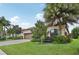 House with tile roof, two-car garage, and landscaped yard at 13215 Ramblewood Trl, Bradenton, FL 34211