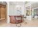 Charming bar area with a granite countertop, wood cabinetry, seating, and decorative accents at 13215 Palmers Creek Ter, Lakewood Ranch, FL 34202