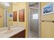 Bright bathroom featuring a vanity with granite counters and a glass-enclosed shower stall at 13215 Palmers Creek Ter, Lakewood Ranch, FL 34202